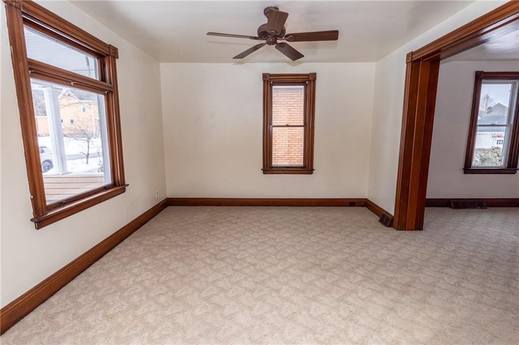 1206 Sycamore Street Connellsville, PA 15425 - Photo 9 of 35 an empty room with windows and fan