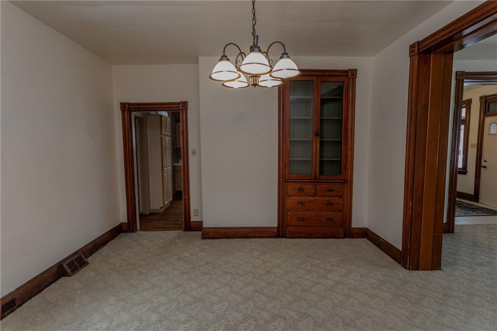1206 Sycamore Street Connellsville, PA 15425 - Photo 10 of 35 wooden floor in an empty room and a bathroom