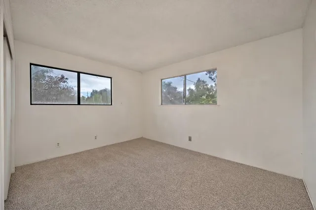 a view of empty room with windows