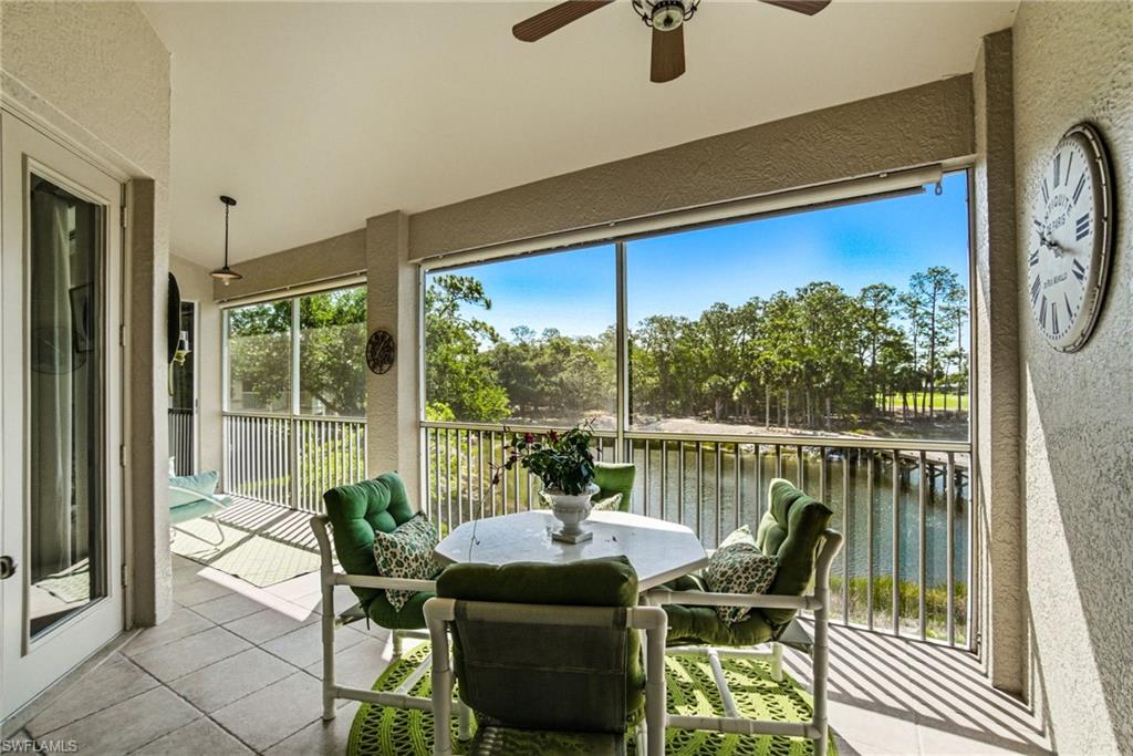 8430 Radcliffe Terrace, Unit 202 Naples, FL 34120 - Photo 15 of 37 a view of a chairs and table in patio