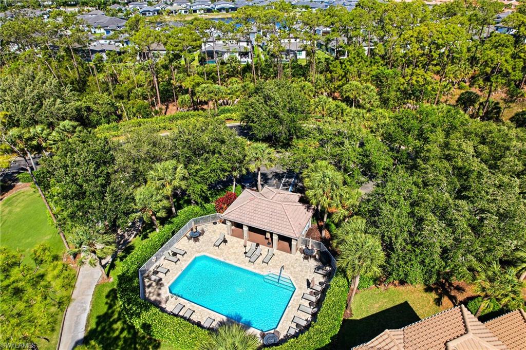 8430 Radcliffe Terrace, Unit 202 Naples, FL 34120 - Photo 25 of 37 an aerial view of a house with a yard swimming pool a patio and yard