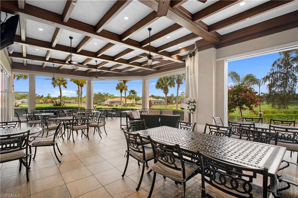 8430 Radcliffe Terrace, Unit 202 Naples, FL 34120 - Photo 31 of 37 a view of a dining room with furniture window and outside view