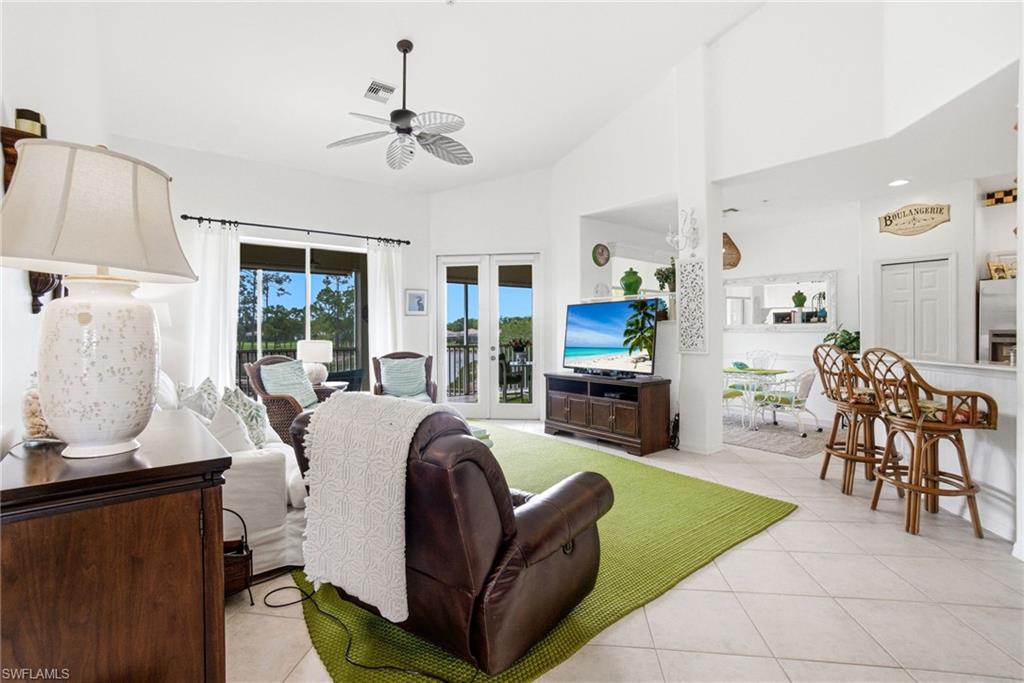 8430 Radcliffe Terrace, Unit 202 Naples, FL 34120 - Photo 37 of 37 a living room with furniture and a large window