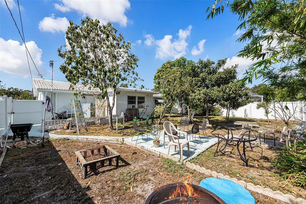 2066 High Ridge Drive Clearwater, FL 33763 - Photo 14 of 15 a view of a house with backyard water fountain and sitting area