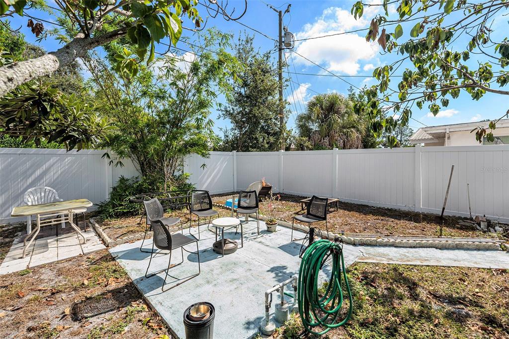 2066 High Ridge Drive Clearwater, FL 33763 - Photo 15 of 15 a view of backyard with swimming pool and sitting area