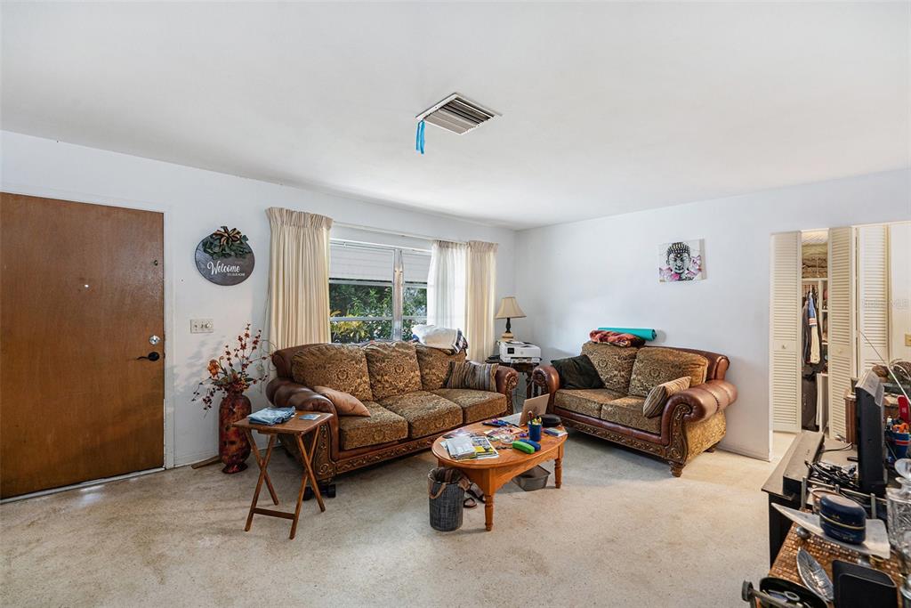 2066 High Ridge Drive Clearwater, FL 33763 - Photo 2 of 15 a living room with furniture a rug and a large window