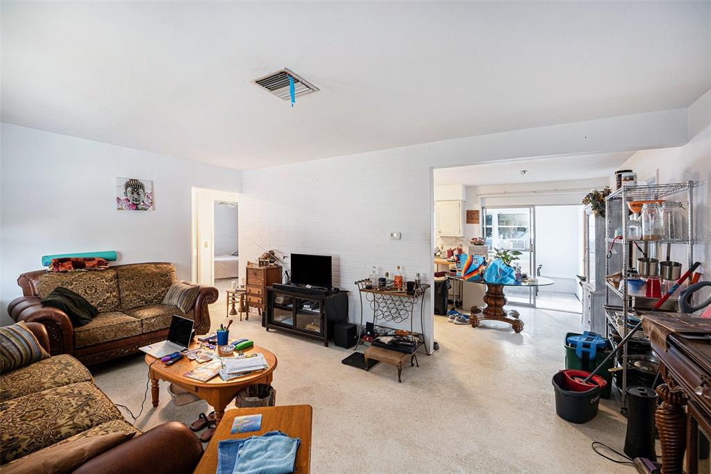 2066 High Ridge Drive Clearwater, FL 33763 - Photo 3 of 15 a living room with furniture a fireplace and a large window