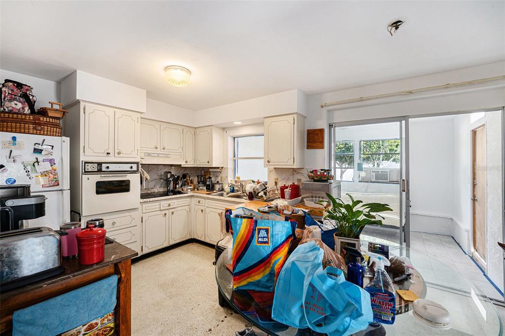 2066 High Ridge Drive Clearwater, FL 33763 - Photo 4 of 15 a view of a kitchen that has a lot of cabinets and appliances