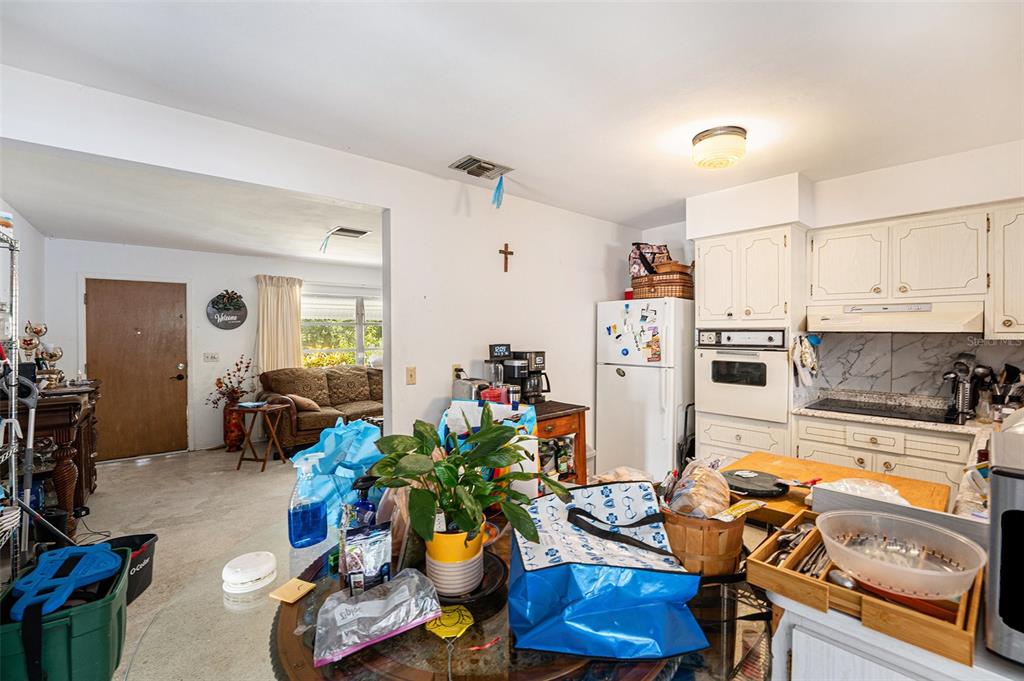 2066 High Ridge Drive Clearwater, FL 33763 - Photo 5 of 15 a kitchen with stainless steel appliances living room and living room view