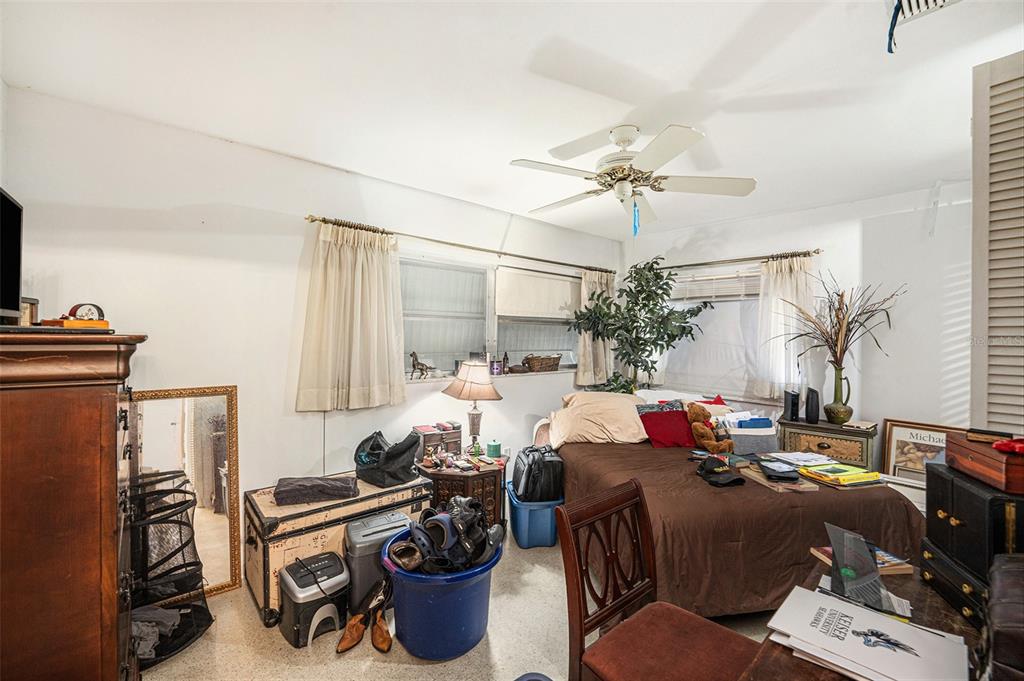 2066 High Ridge Drive Clearwater, FL 33763 - Photo 6 of 15 a living room with furniture a chandelier and a fireplace