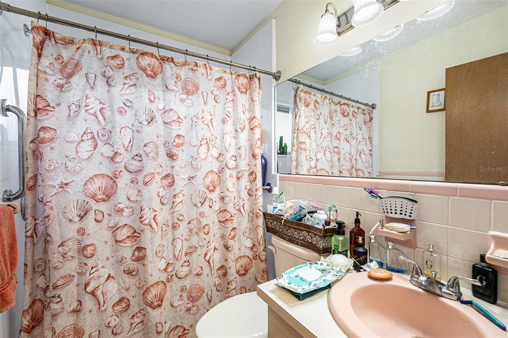 2066 High Ridge Drive Clearwater, FL 33763 - Photo 9 of 15 a bathroom with a sink toilet and shower