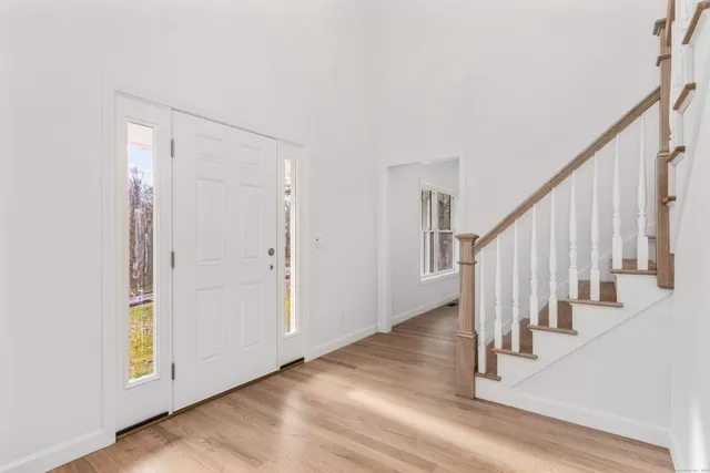 a view of entryway with wooden floor