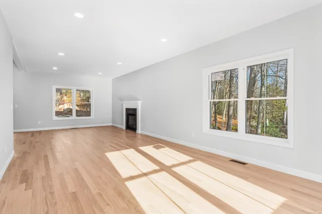 a view of an empty room and a window