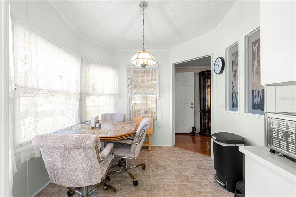 13081 Southeast 47th Court Belleview, FL 34420 - Photo 14 of 42 a living room with furniture and a window