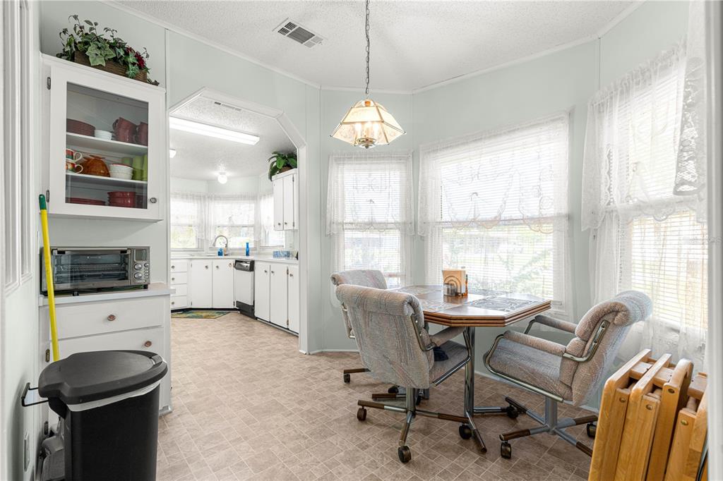 13081 Southeast 47th Court Belleview, FL 34420 - Photo 15 of 42 a view of a livingroom with workspace and a window