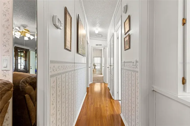 a view of hallway with livingroom