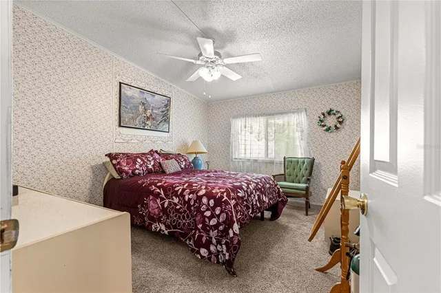 a bedroom with bed and window