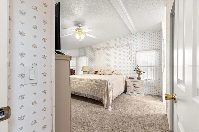 a room with a bed and a chandelier