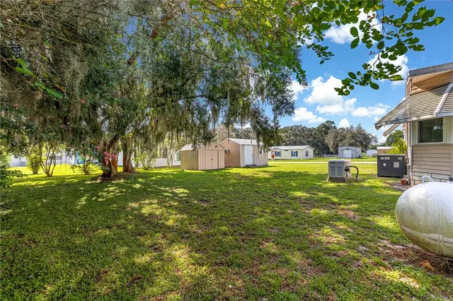 a view of a house with a big yard