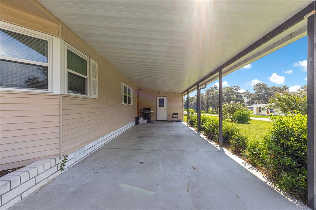 13081 Southeast 47th Court Belleview, FL 34420 - Photo 5 of 42 a view of a house with a big yard