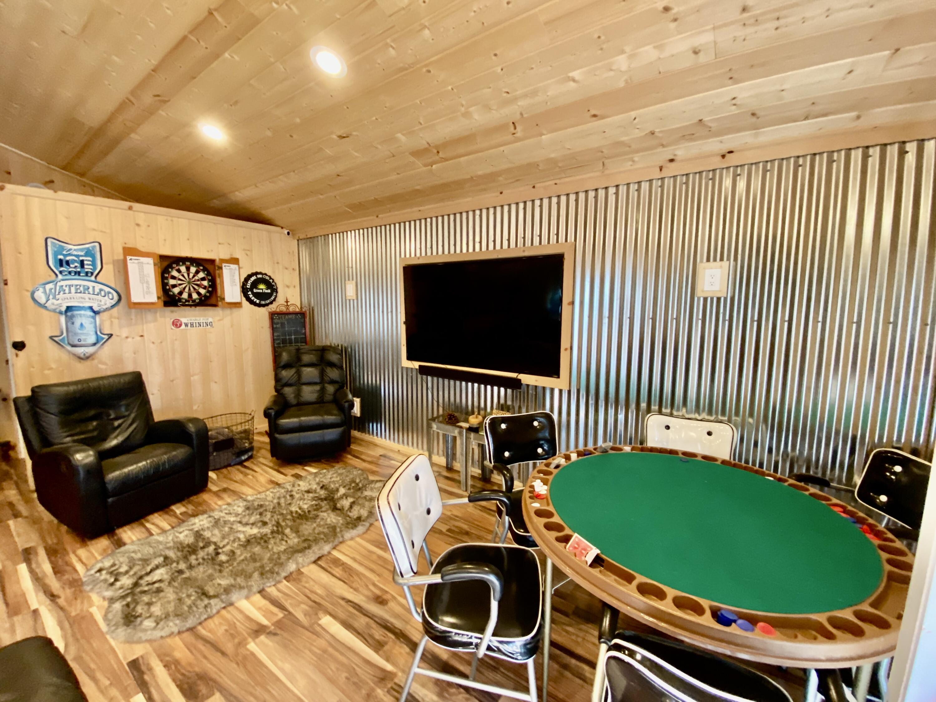 a room with furniture and a flat screen tv