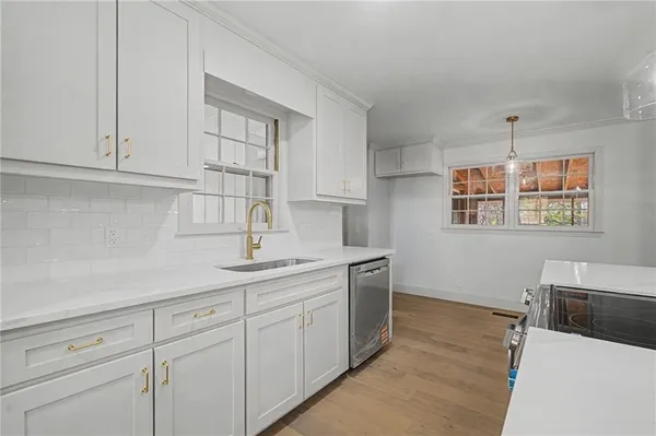 a kitchen with a sink and cabinets