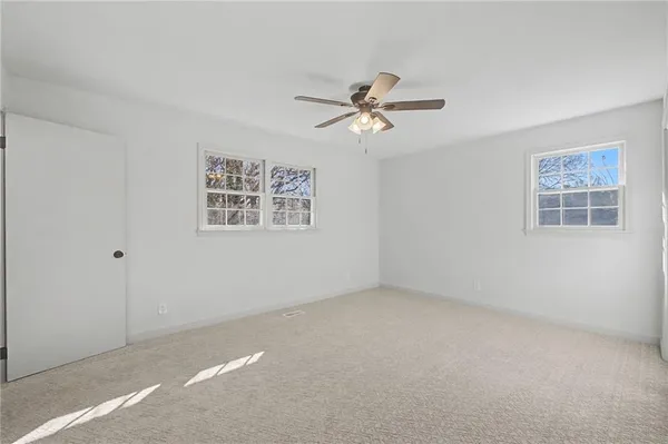 a view of a big room with carpet