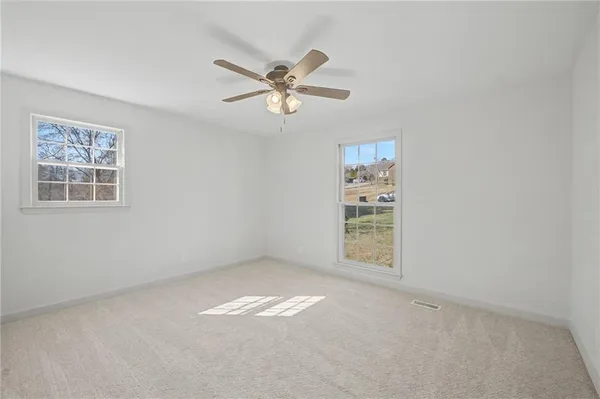 a view of an empty room with a window