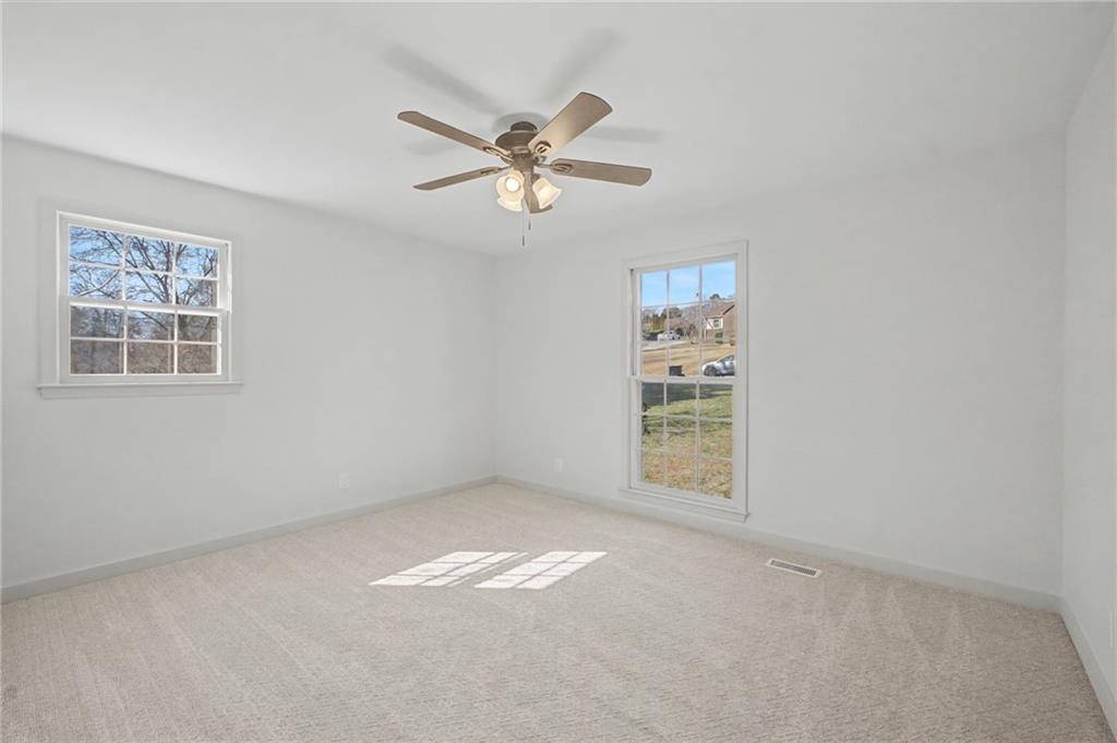 115 Devonwood Drive Calhoun, GA 30701 - Photo 20 of 35 a view of an empty room with a window