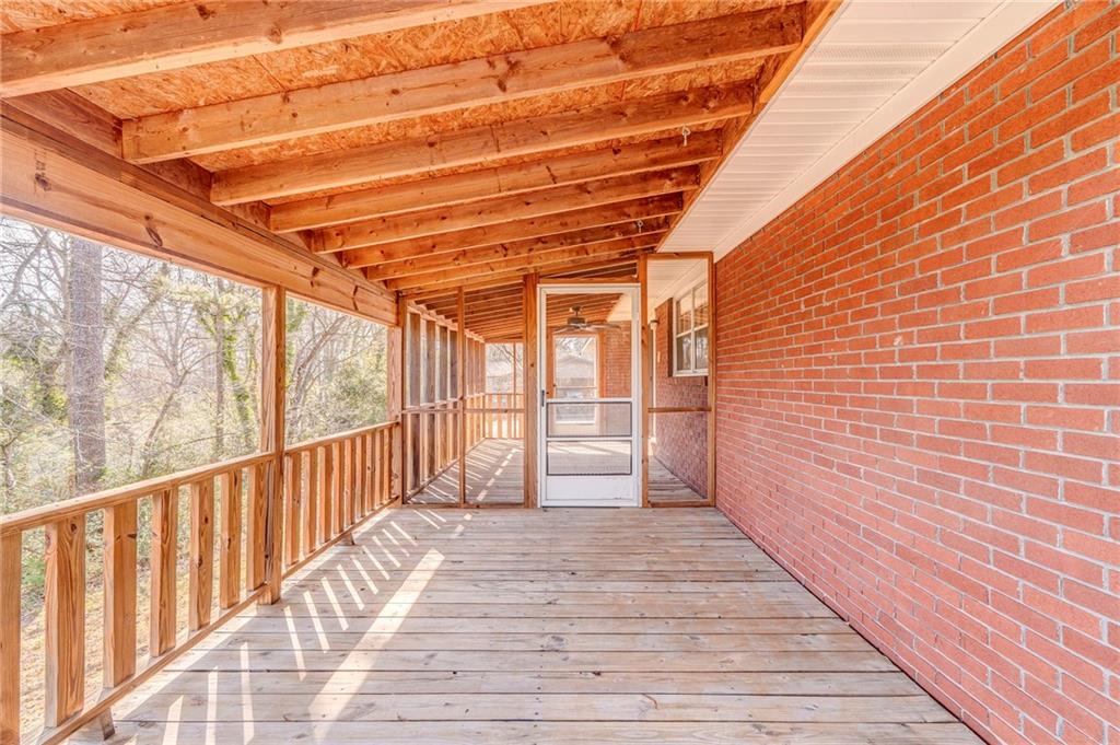 115 Devonwood Drive Calhoun, GA 30701 - Photo 29 of 35 a view of a porch with wooden floor and iron stairs