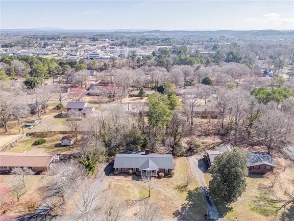 an aerial view of residential house with outdoor space