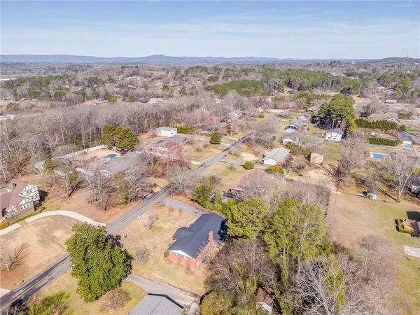 an aerial view of residential houses with outdoor space