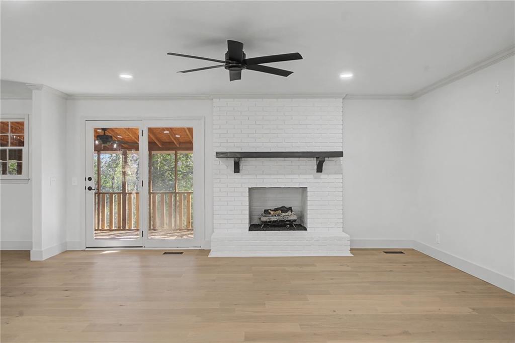 115 Devonwood Drive Calhoun, GA 30701 - Photo 5 of 35 a view of an empty room with a fireplace and a window