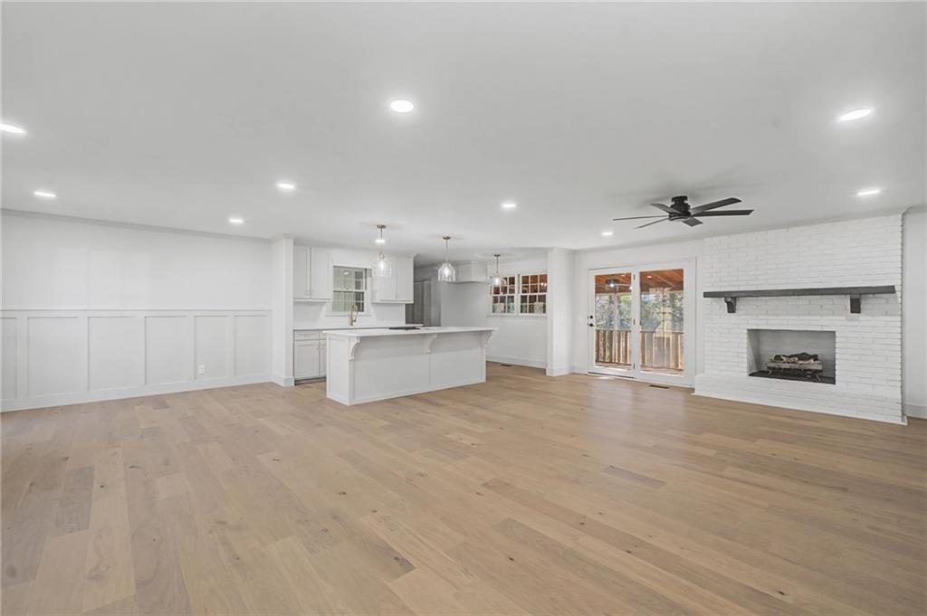 115 Devonwood Drive Calhoun, GA 30701 - Photo 6 of 35 a view of a kitchen with a sink and a fireplace