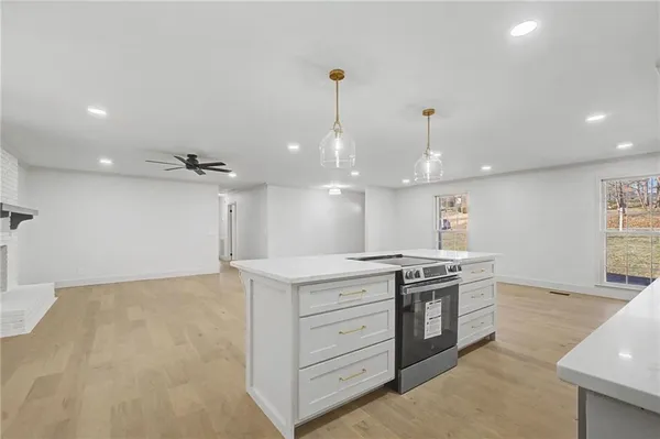 a kitchen with a stove and a sink