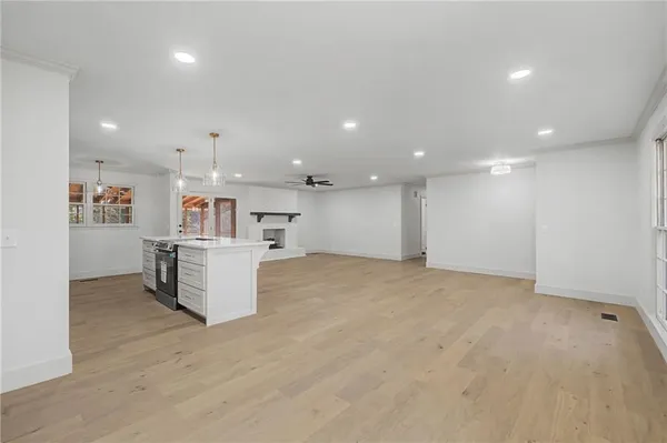 a view of kitchen with cabinets and wooden floor