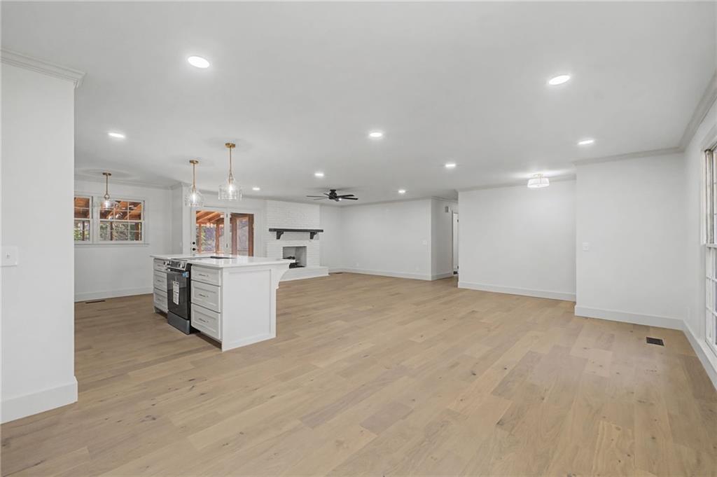 115 Devonwood Drive Calhoun, GA 30701 - Photo 8 of 35 a view of kitchen with cabinets and wooden floor