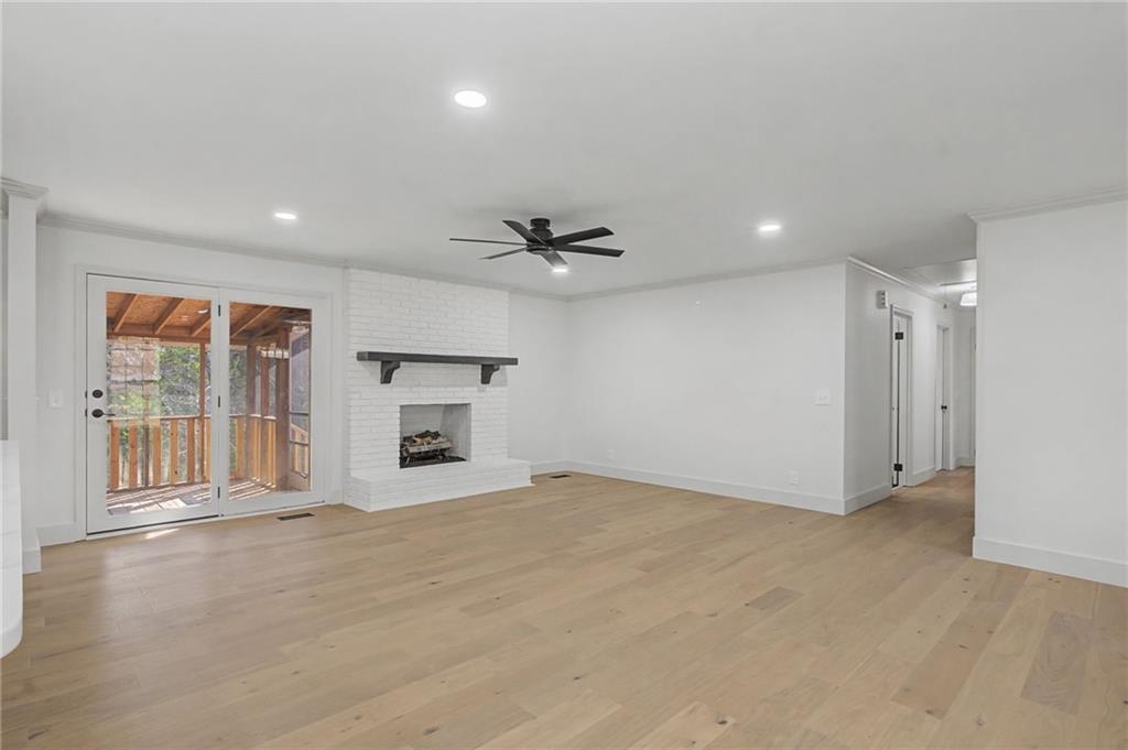 115 Devonwood Drive Calhoun, GA 30701 - Photo 9 of 35 a view of an empty room with a fireplace and a window