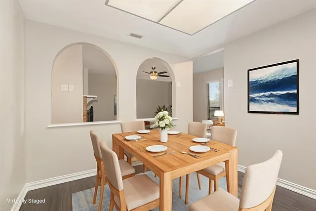 a view of a dining room with furniture and wooden floor