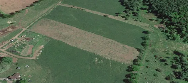 a view of a lake with a yard