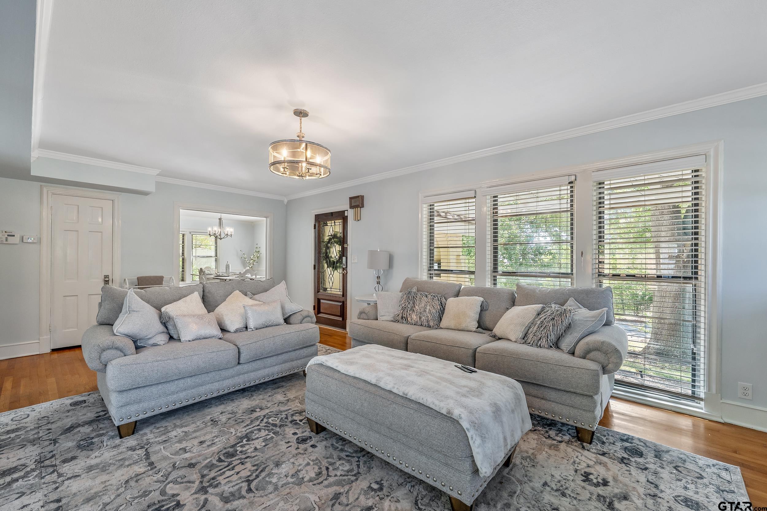 145 Rowland Place Tyler, TX 75701 - Photo 14 of 43 a living room with furniture and a chandelier