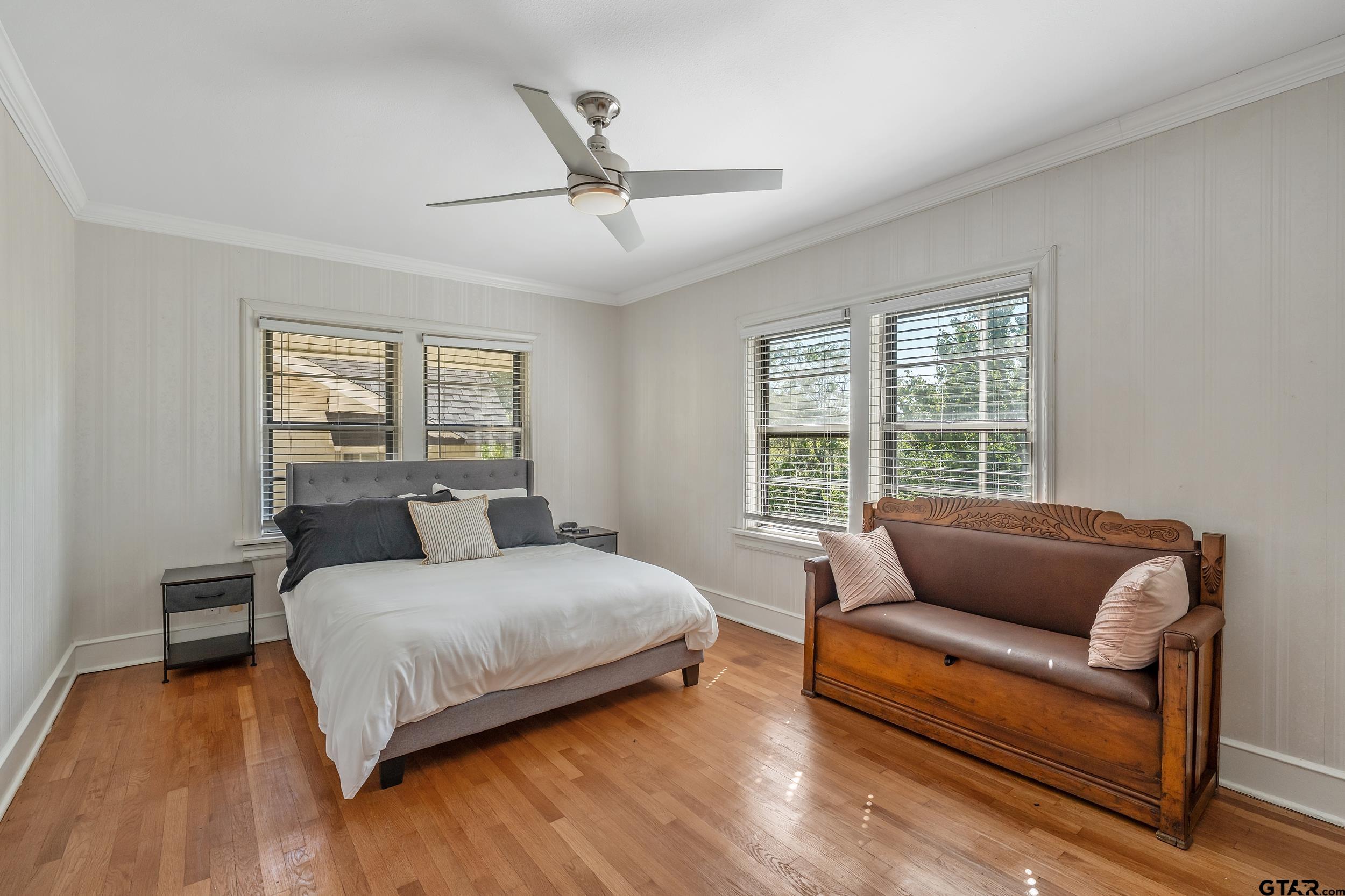 145 Rowland Place Tyler, TX 75701 - Photo 23 of 43 a bedroom with a bed couch and window