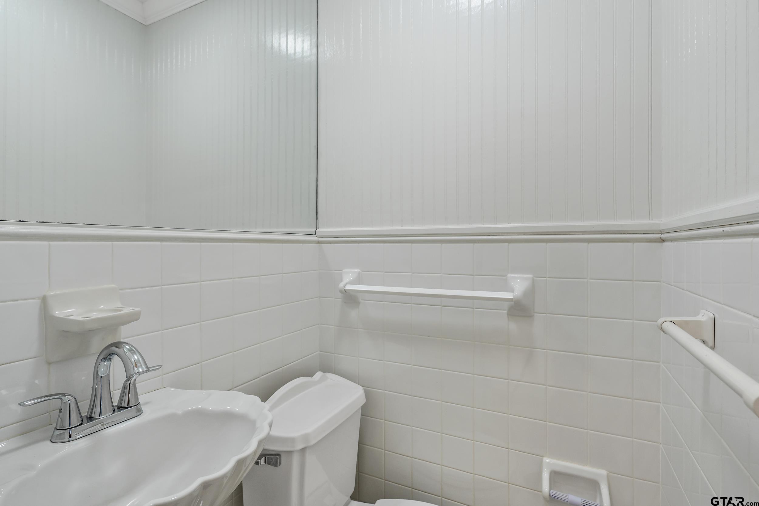 145 Rowland Place Tyler, TX 75701 - Photo 30 of 43 a bathroom with a sink and a toilet