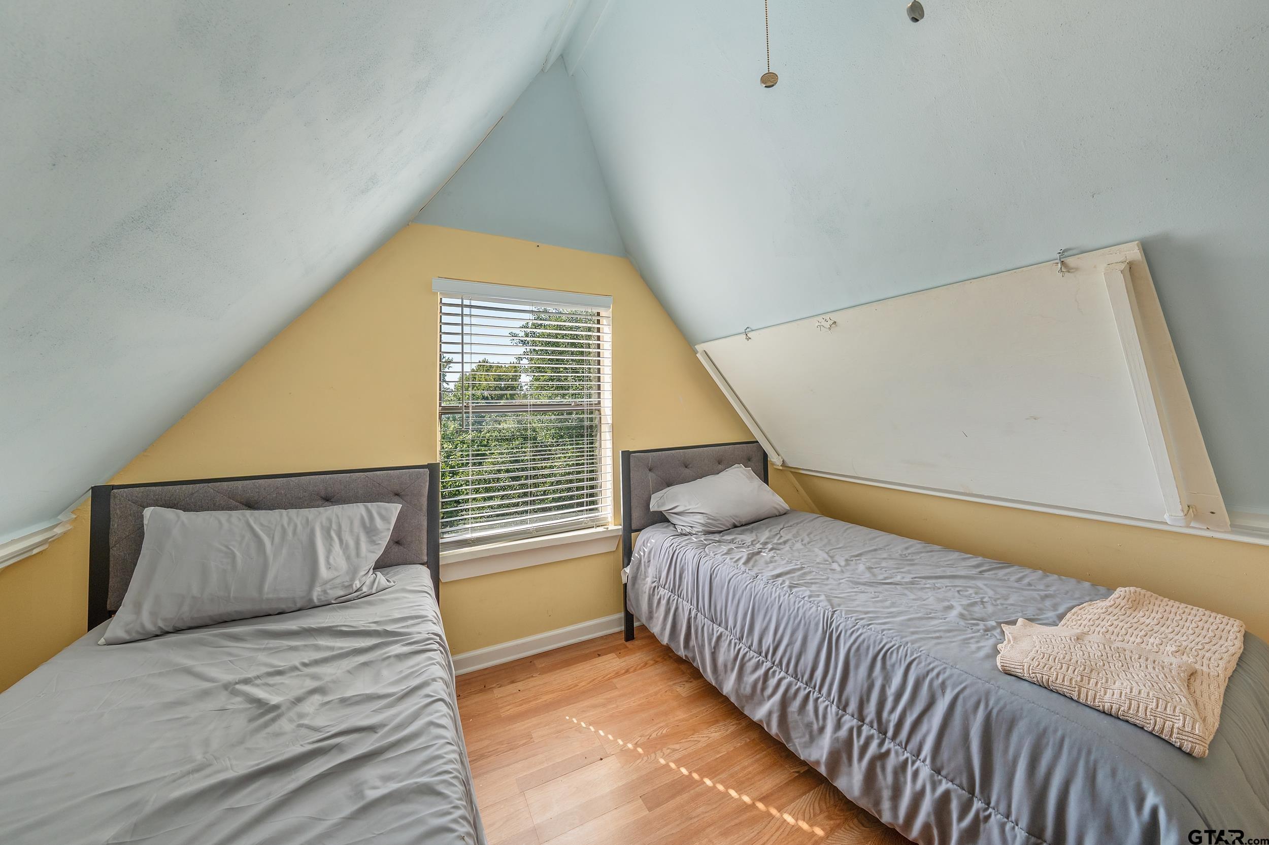 145 Rowland Place Tyler, TX 75701 - Photo 34 of 43 a bedroom with a bed and a large window