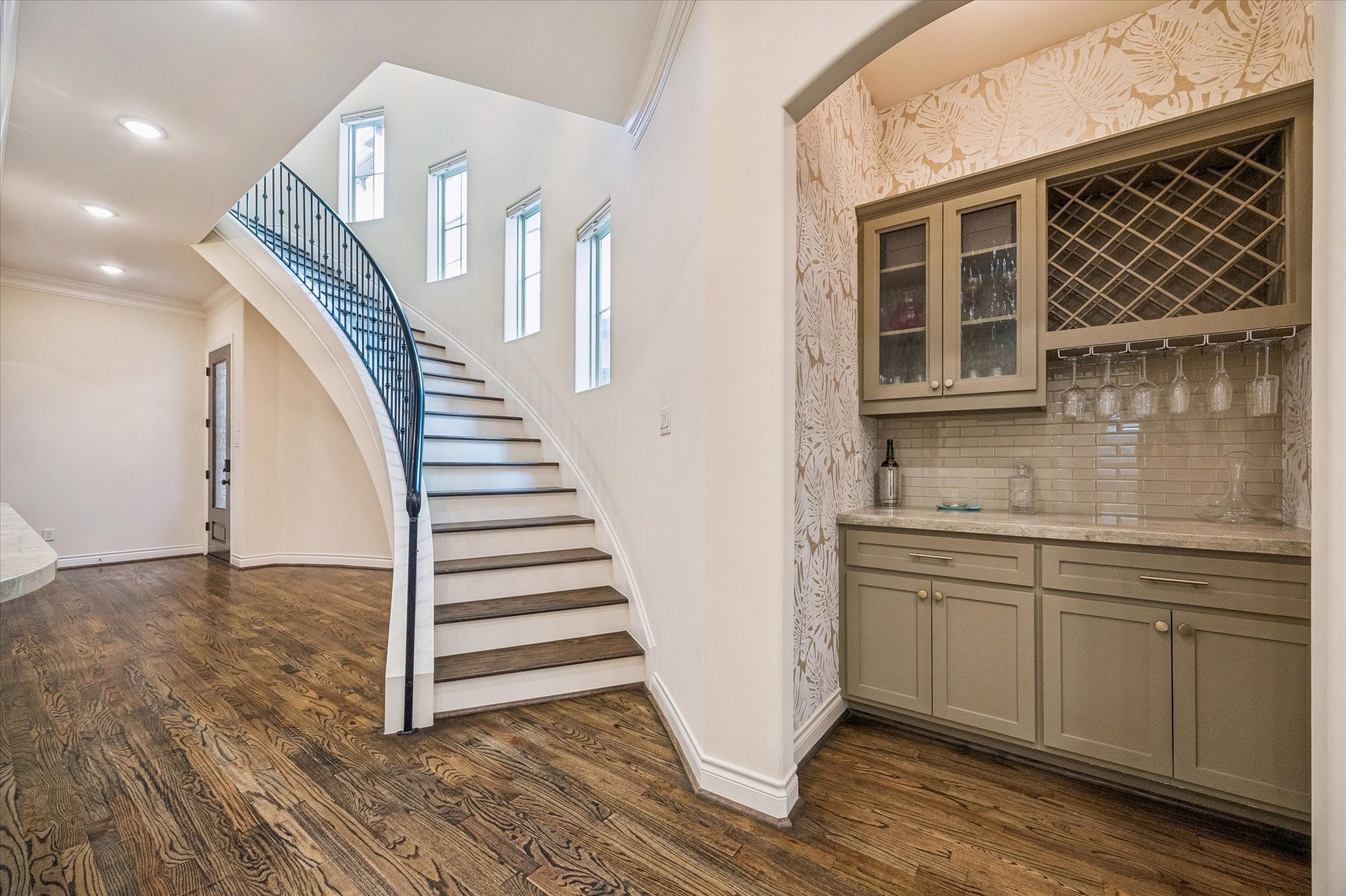 5305 Gibson Street Houston, TX 77007 - Photo 11 of 46 a view of a kitchen with wooden floor and stairs