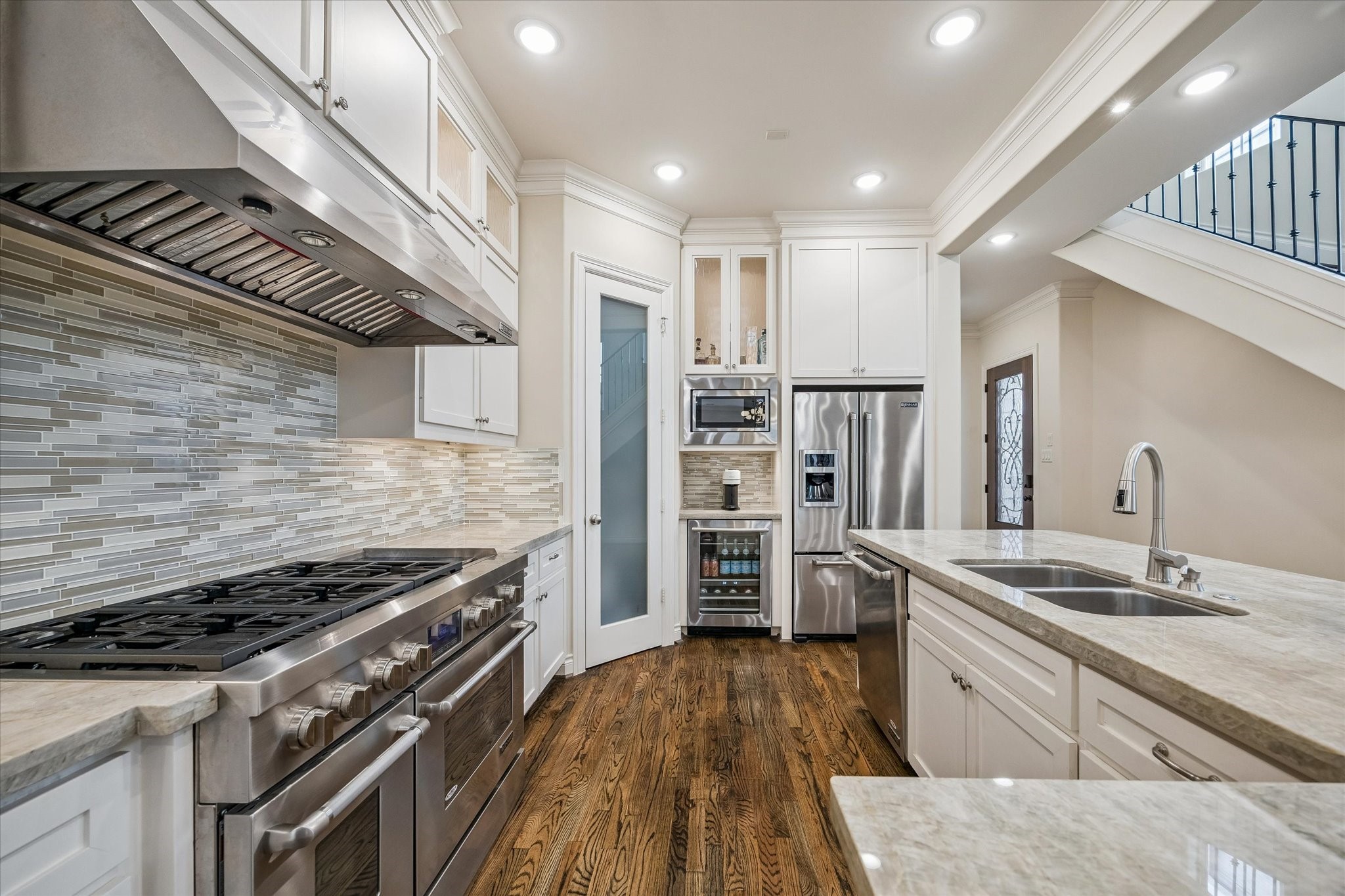5305 Gibson Street Houston, TX 77007 - Photo 14 of 46 a kitchen with refrigerator and cabinets