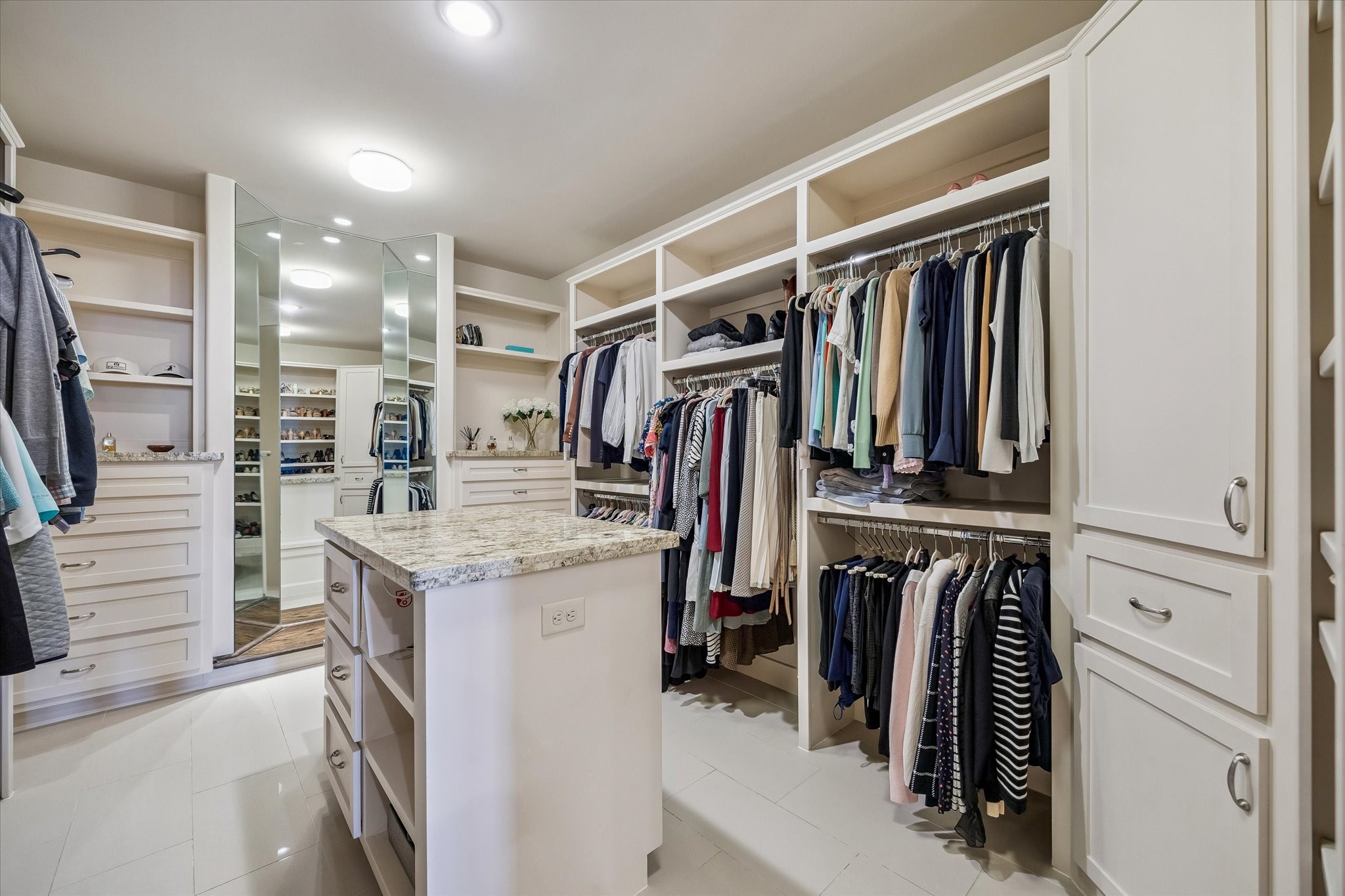 5305 Gibson Street Houston, TX 77007 - Photo 26 of 46 a view of walk in closet with clothes and shoes