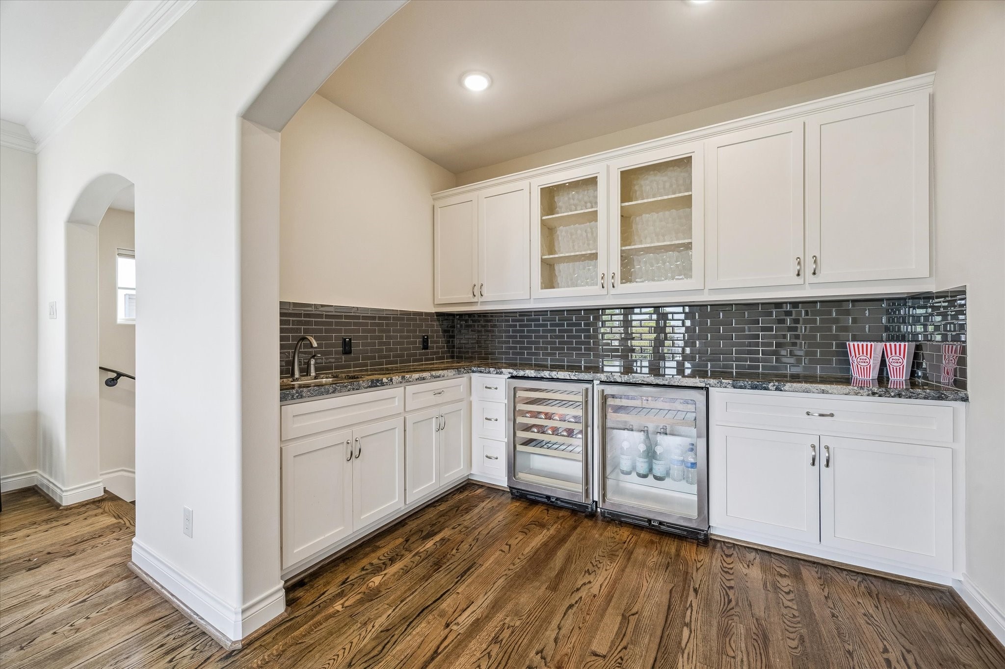 5305 Gibson Street Houston, TX 77007 - Photo 35 of 46 a kitchen with granite countertop white cabinets and white appliances