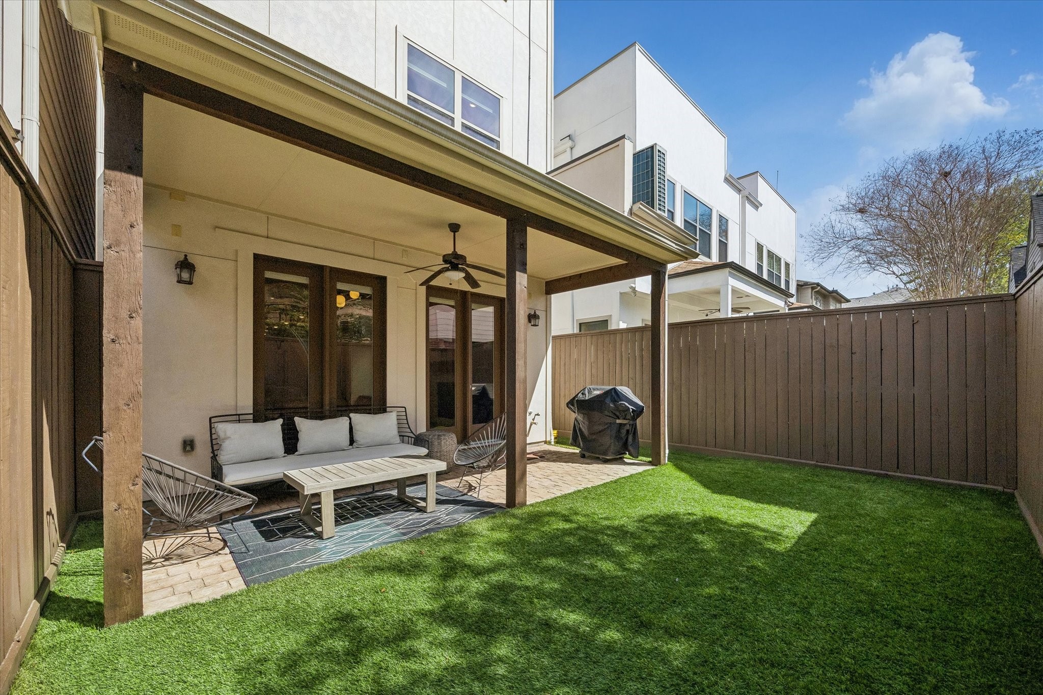 5305 Gibson Street Houston, TX 77007 - Photo 41 of 46 a view of a patio with table and chairs and wooden fence