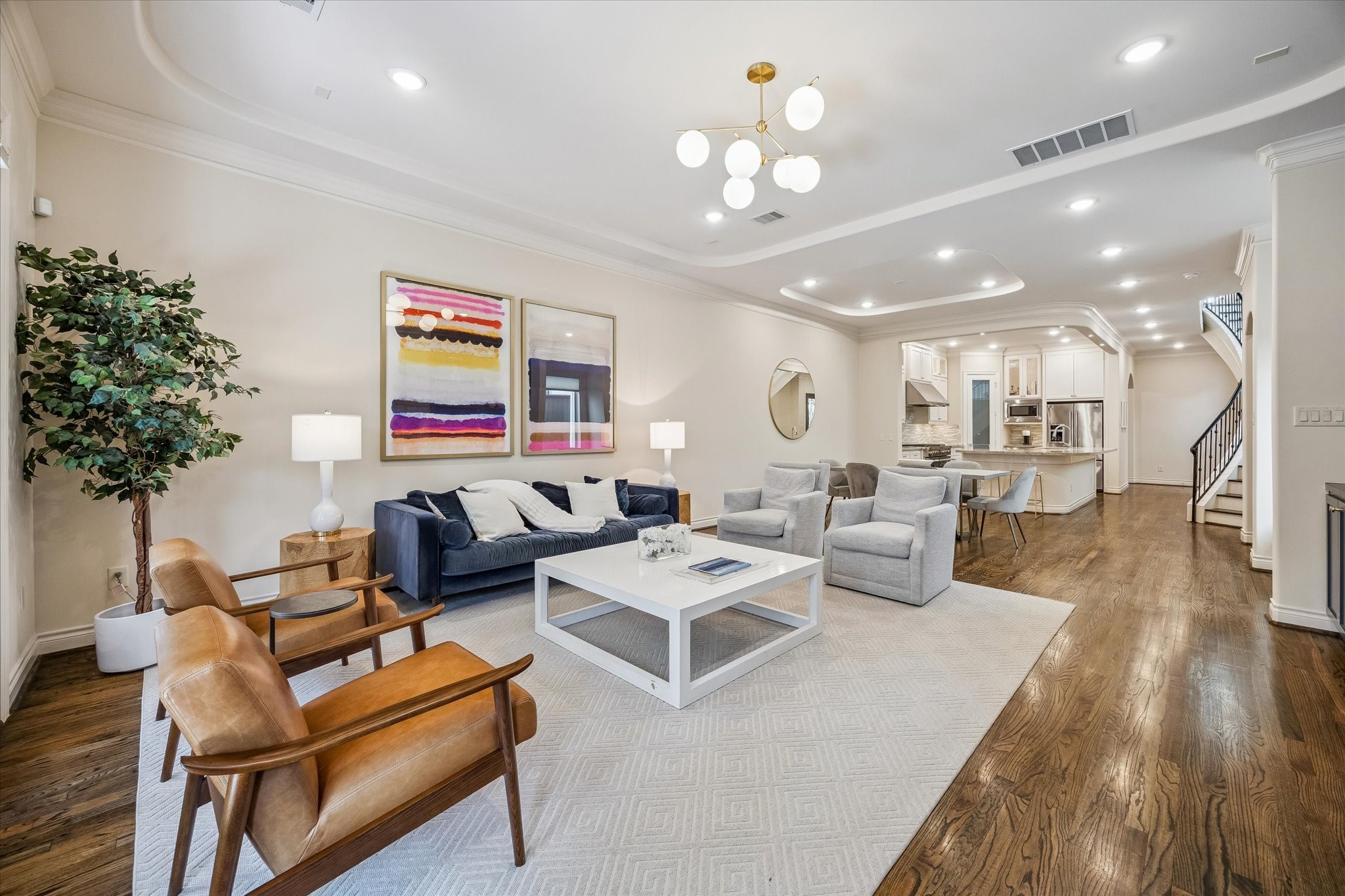 5305 Gibson Street Houston, TX 77007 - Photo 6 of 46 a living room with furniture kitchen and a chandelier
